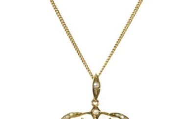 An Edwardian gold aquamarine and split pearl pendant