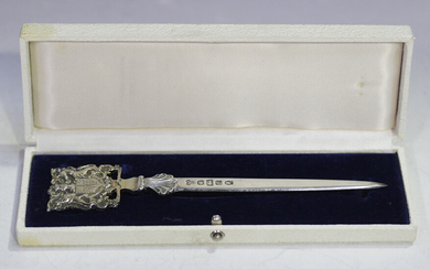 An Elizabeth II silver paperknife commemorating the Queen's Silver Jubilee, the finial in the f