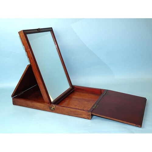 An early-19th century mahogany travelling mirror, the rectan...