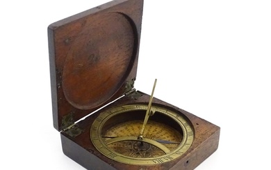 An early 19thC mahogany cased brass compass, together with a...