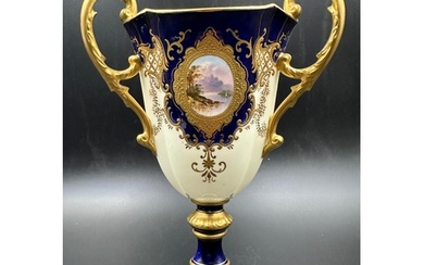 An early 20th Century Coalport, three handled goblet with bl...