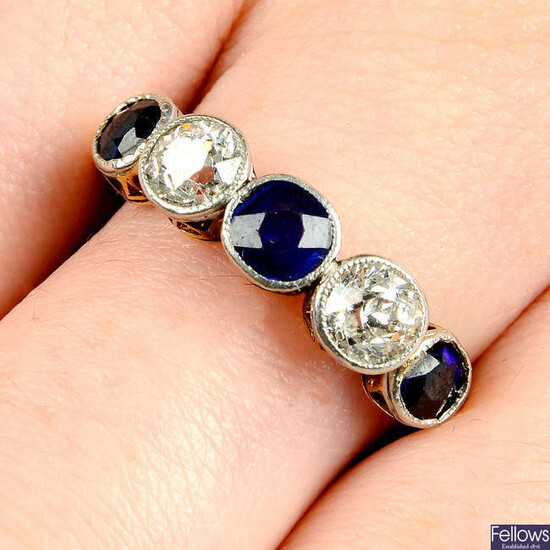 An early 20th century platinum and gold, graduated sapphire and old-cut diamond five-stone ring.