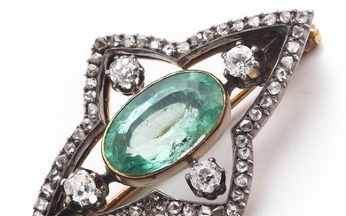An emerald and diamond brooch with an oval-cut emerald weighing app. 3.30 ct. and diamonds weighing a total of app. 1.00 ct., mounted in gold and silver. 1900.