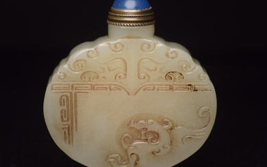 An exquisite white jade snuff bottle