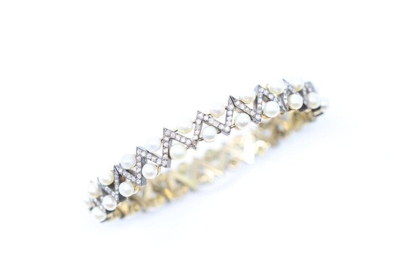 Articulated bracelet in 18k (750) yellow gold and silver holding...