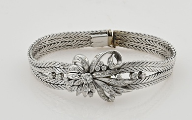 Bracelet en or blanc, 585/000, avec diamants. Bracelet composé de deux rangées de maillons plats...