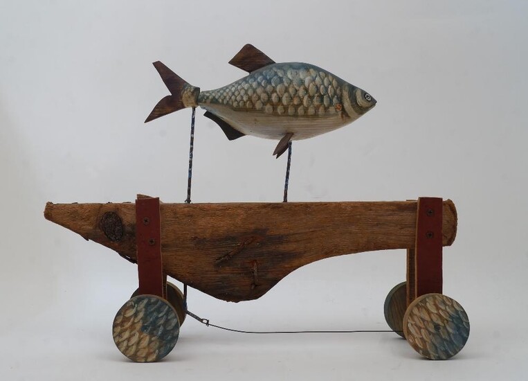 British School, 20th century- Fish; painted carved wood and metal on wooden wheels, 31 x 41 x 11cm (ARR)