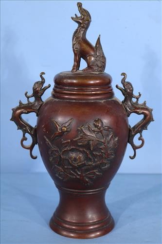 Bronze Oriental incense burner with dragon handle