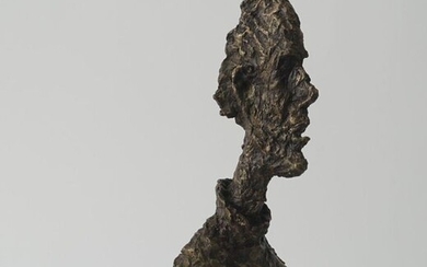Bronze sculpture on stone base, Man's bust after Giacometti, 21st century, h. 40 cm.