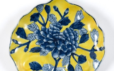 CHINESE MING-STYLE IMPERIAL YELLOW PORCELAIN DISH In palmette shape, with blue floral decoration. Marked on base. Length 6.25".