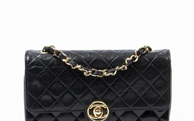 Chanel: A "Vintage Single Flap" bag made of black quilted leather with gold tone hardware, chain strap and one compartment. – Bruun Rasmussen Auctioneers of Fine Art