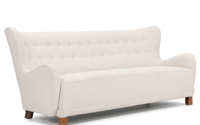 Danish cabinetmaker: Freestanding three seather sofa with legs of stained beech. Upholstered with light wool. L. 202 cm.