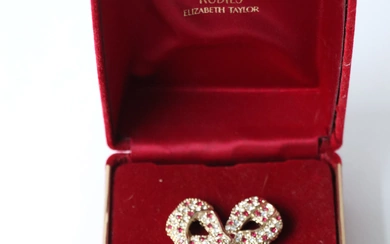 Diamonds and rubies Elizabeth Taylor. Petit flacon à parfum avec bouchon en forme de nœud....