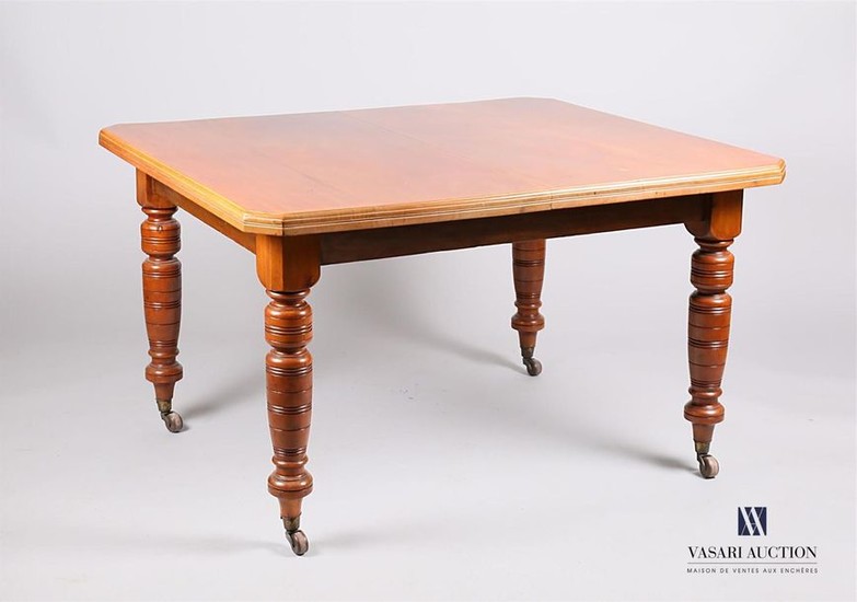 Dining table in mahogany veneer, the rectangular shaped...