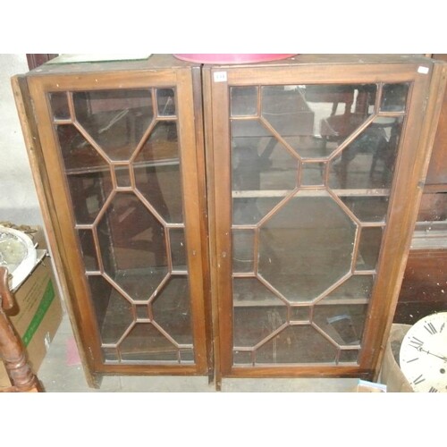 Edwardian mahogany bookcase sections, having columns, with a...