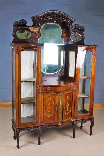 Edwardian mahogany inlaid mirrored back display cabinet, the fret carved mirror back above a pair of