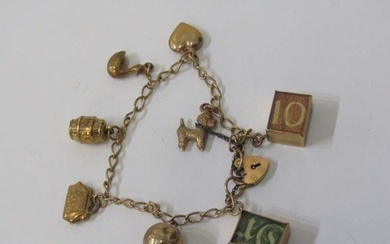 GOLD CHARM BRACELET, 9ct yellow gold charm bracelet with pad...