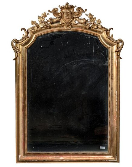 LARGE MIRROR In gilded wood and gilded stucco,...