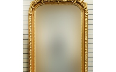 Large ornate gilt framed wall mirror having bevelled glass m...