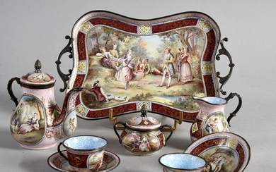 MINIATURE TEA SERVICE, VIENNA, CIRCLE 1900.Head to head model, in polychrome enamels with romantic scenes, gilt mount, consisting of a tray (good condition), a teapot (accident), a covered sugar bowl (good condition), a milk jug (good condition)...