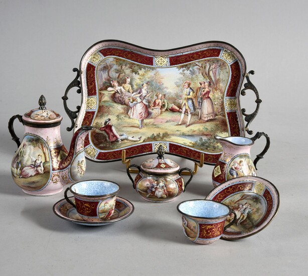 MINIATURE TEA SERVICE, VIENNA, CIRCLE 1900.Head to head model, in polychrome enamels with romantic scenes, gilt mount, consisting of a tray (good condition), a teapot (accident), a covered sugar bowl (good condition), a milk jug (good condition)...