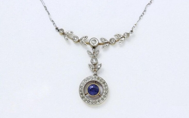 Necklace in 750 gold and 850 thousandths platinum, centered on a diamond leaf motif holding a round facetted sapphire in a pearled closed setting in a setting of diamond roses as a pendant. Bracelet chain bracelet adorned with a spring ring clasp...