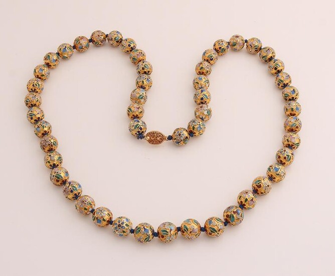 Necklace of gold colored beads, &#248 12mm, inlaid