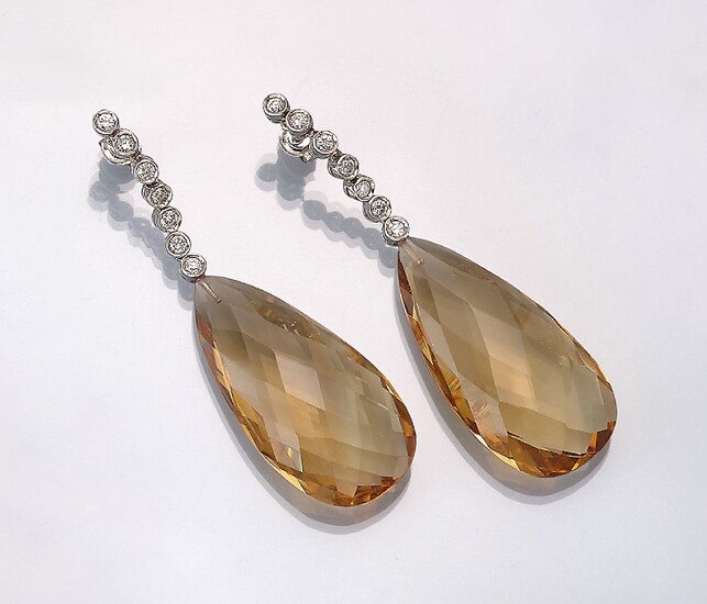 Pair of 18 kt gold earrings with citrines...