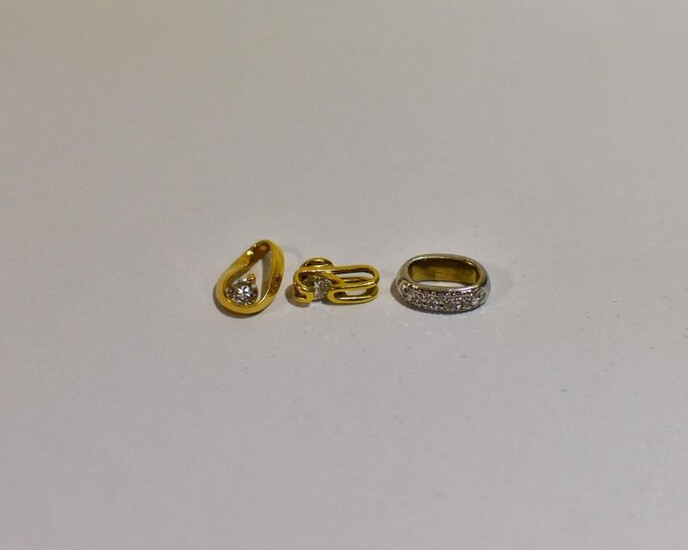 Set of three yellow and white gold pendants (750 thousandths) set with diamonds.
