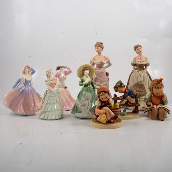 Six Coalport figurines and three Goebel Hummel figures.