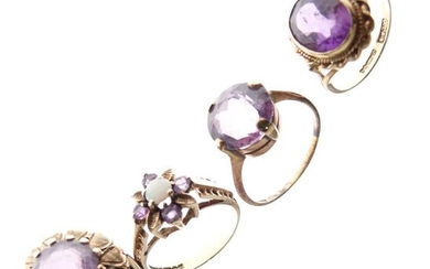 Three 9ct gold dress rings, each set amethyst-coloured stone,...