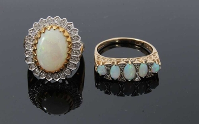Two 9ct gold and diamond dress rings, one with an oval opal cabochon measuring approximately 13.5mm x 9.7mm surrounded by a border of single cut diamonds, size N, the other ring with five graduated...