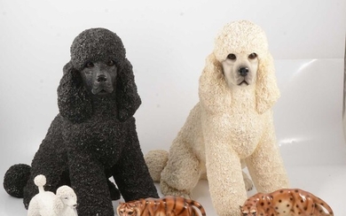 Two large resin poodles, other poodle models and ornaments