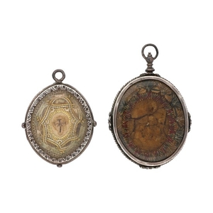 Two reliquary pendants in silver, 17th Century.