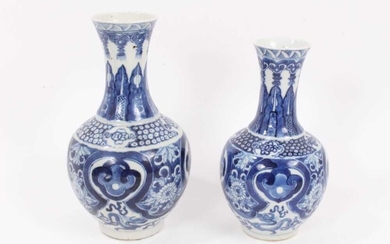 Two similar 19th century Chinese blue and white bottle vases, both decorated with dragons, foliate patterns, ruyi symbols, etc, marks to bases, 22cm and 24.5cm high