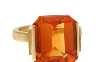 Wiwen Nilsson: A citrine ring set with an emerald-cut citrine, mounted in 18k gold. Front app. 14.5×14 mm. Size 51. Sweden, 1961.