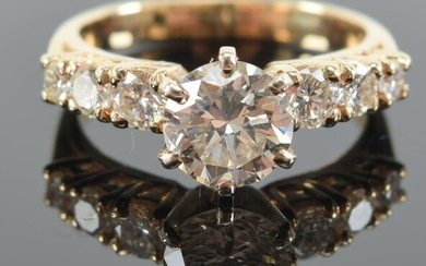 14 kt gold diamond solitaire engagement ring. Round