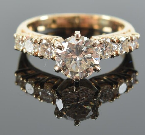 14 kt gold diamond solitaire engagement ring. Round