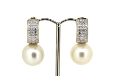 14K Yellow Gold White Pearl and Diamond Earrings. The centre...