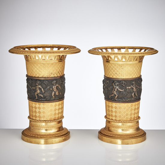 2855227. TABLE SETS, a pair, Restoration, France first half of the 19th century, matted and polished burnished gilt and dark patinated bronze.