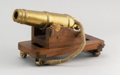 BRASS MODEL OF A CARRONADE Based on plans for cannons used on the U.S.S. Constitution. Wooden carriage with brass wheels and copper...