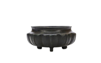 A CHINESE BRONZE TRIPOD CENSER. Ming Dynasty. The...