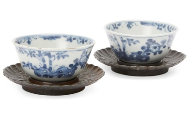 A pair of Chinese porcelain tea bowls,...