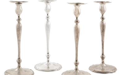 Four American sterling silver base loaded candlesticks