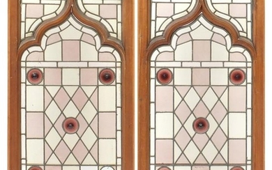 Pair of oak framed leaded stained glass panels, framed