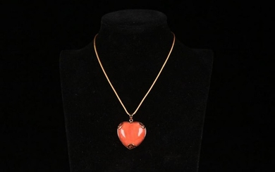 A RED-CORAL PENDANT EMBEDED GOLD