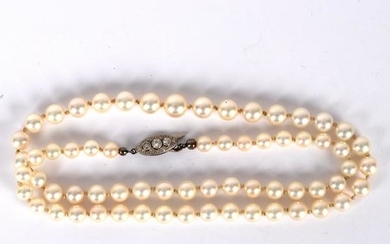 A single row of sixty-five graduated cultured pearls