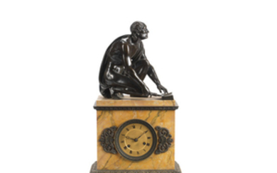A mid 19th century French patinated bronze and Sienna marble figural clock