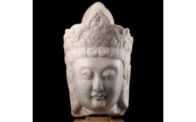 A marble head of Guanyin, depicted with serene expression, wearing a crown, on a wood base (defects) China, 19th century...