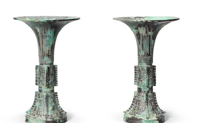 A pair of archaic bronze ritual wine vessels, gu